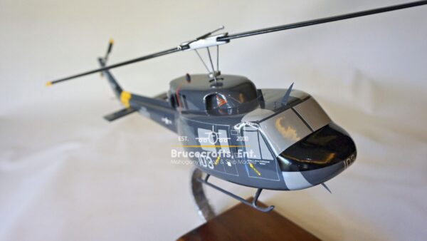 Model of UH-1N Twin Huey US NAVY 103 Aircraft with detailed craftsmanship.